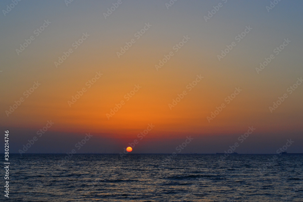 bright yellow circle of sun pink orange red dawn, sunset at sea, ocean, sky gradient, evening, morning bright yellow circle of sun pink orange red dawn, sunset at sea, ocean, sky gradient, evening, morning