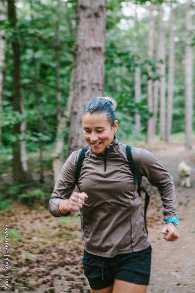 Woman enjoying her workout in woodland. Woman enjoying her workout in woodland.