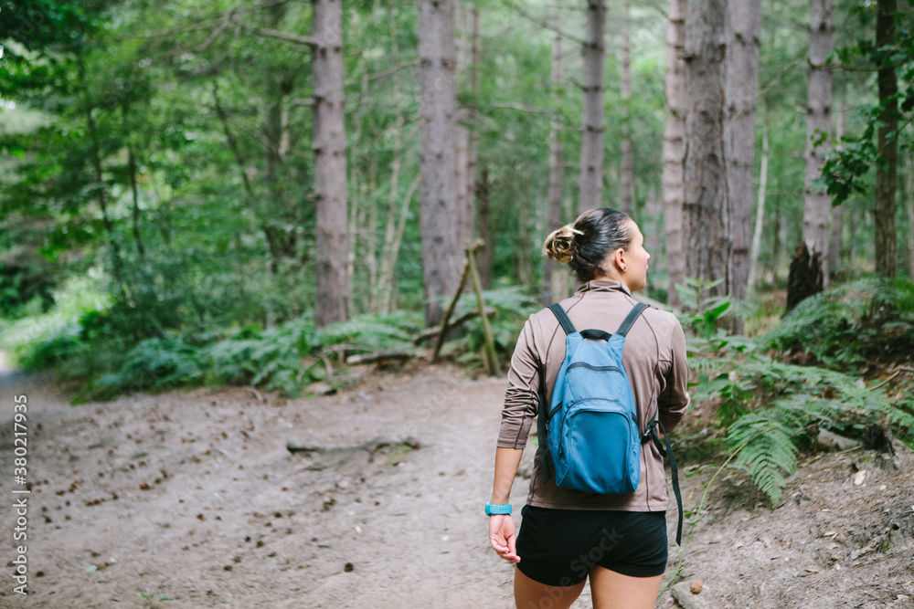 Woman walking in a natural park. Woman walking in a natural park.
