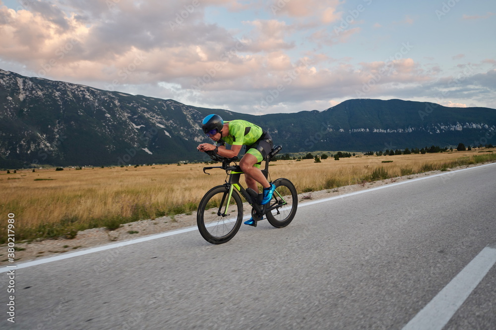 Fototapeta premium triathlon athlete riding bike