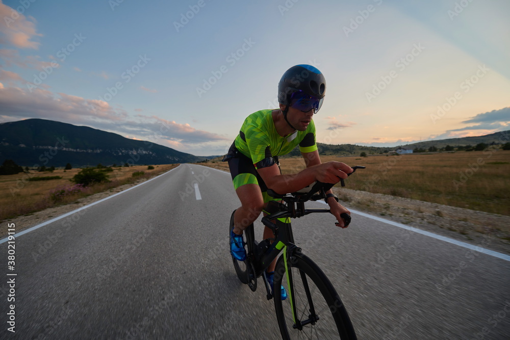 Fototapeta premium triathlon athlete riding bike