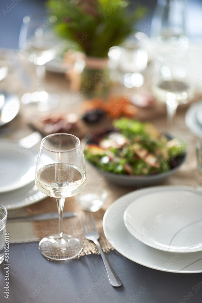 Crockery, cutlery and glasses set up for a party Crockery, cutlery and glasses set up for a party