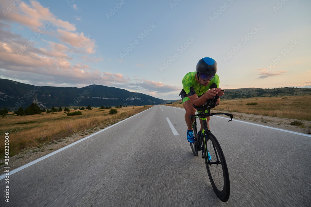 Fototapeta premium triathlon athlete riding bike