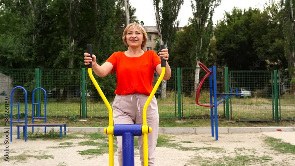 beautiful healthy woman 58 years old doing exercises outdoors beautiful healthy woman 58 years old doing exercises outdoors