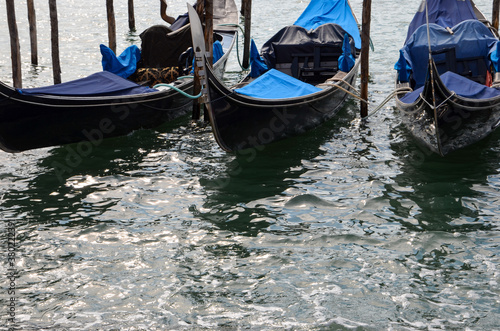 Gondolas in Venice in the morning, reflections of sunlight on water surface, seen from San Marco square, Italy © ClaudiaRMImages