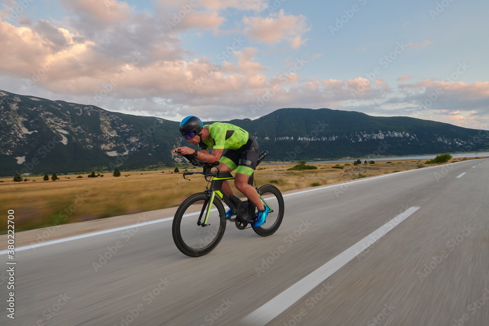 triathlon athlete riding bike triathlon athlete riding bike