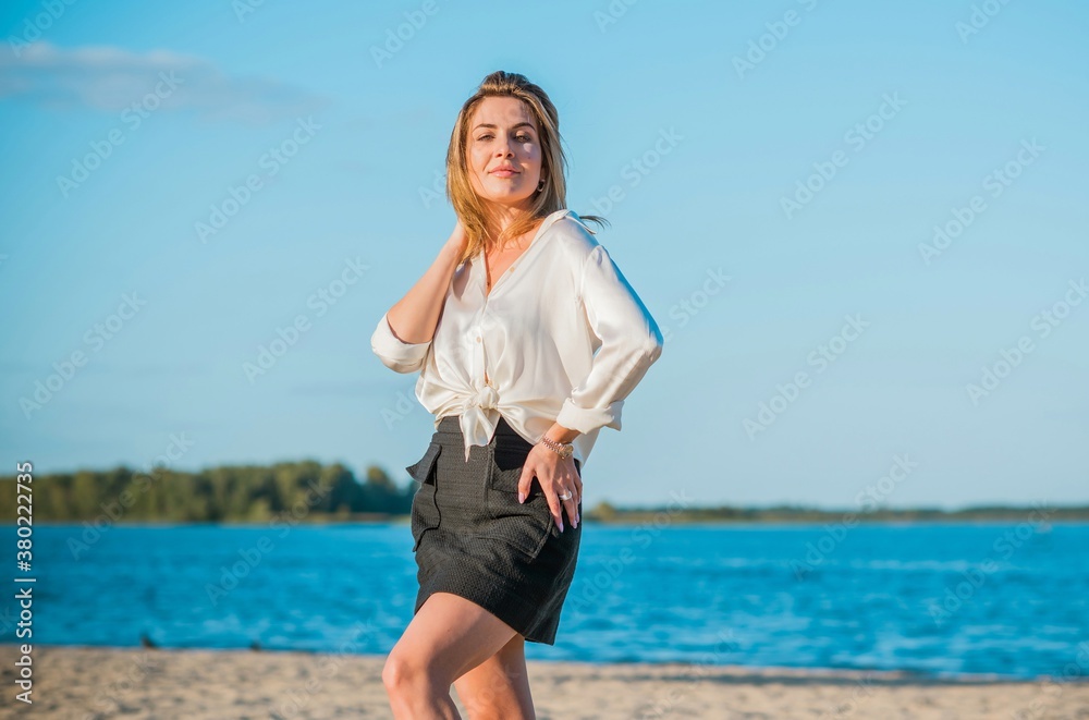 Relax time, elegant woman rest at beach. Nice femininity blonde hair lady, tranquility and freedom concept Relax time, elegant woman rest at beach. Nice femininity blonde hair lady, tranquility and freedom concept
