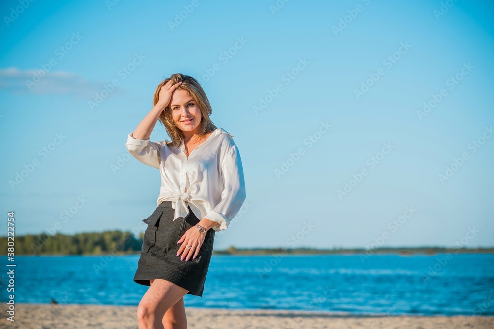 Relax time, elegant woman rest at beach. Nice femininity blonde hair lady, tranquility and freedom concept Relax time, elegant woman rest at beach. Nice femininity blonde hair lady, tranquility and freedom concept