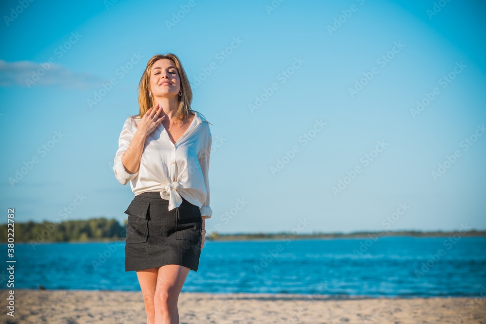 Relax time, elegant woman rest at beach. Nice femininity blonde hair lady, tranquility and freedom concept Relax time, elegant woman rest at beach. Nice femininity blonde hair lady, tranquility and freedom concept