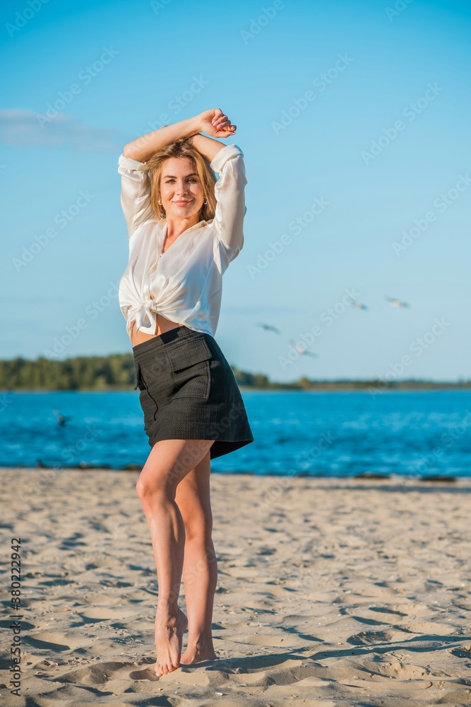 Relax time, elegant woman rest at beach. Nice femininity blonde hair lady, tranquility and freedom concept