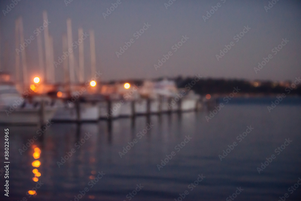 Yachts moored at a yacht club at dusk Yachts moored at a yacht club at dusk