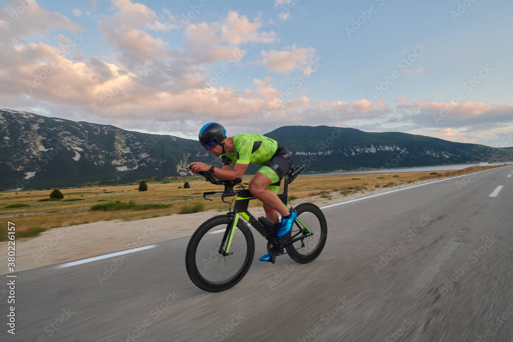 triathlon athlete riding bike triathlon athlete riding bike