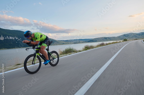 Fototapeta Naklejka Na Ścianę i Meble -  triathlon athlete riding bike