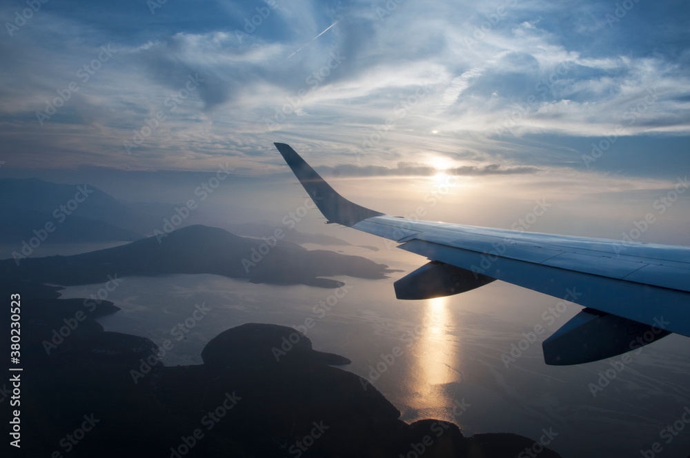 airplane wing over the sea airplane wing over the sea
