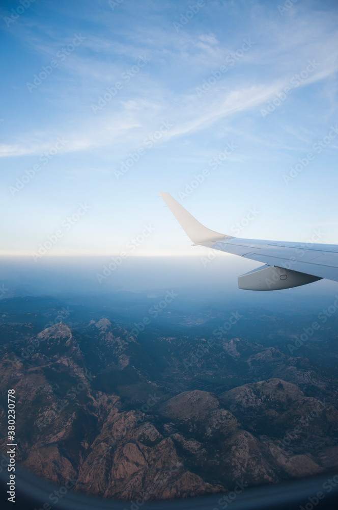 airplane wing over the mountains airplane wing over the mountains