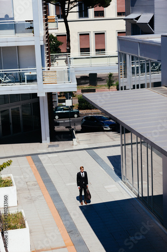 Modern Urban Area with One Businessman in the Middle photo