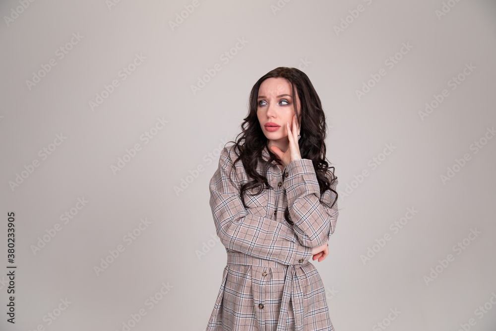 Beautiful girl student business woman thought on gray background Beautiful girl student business woman thought on gray background