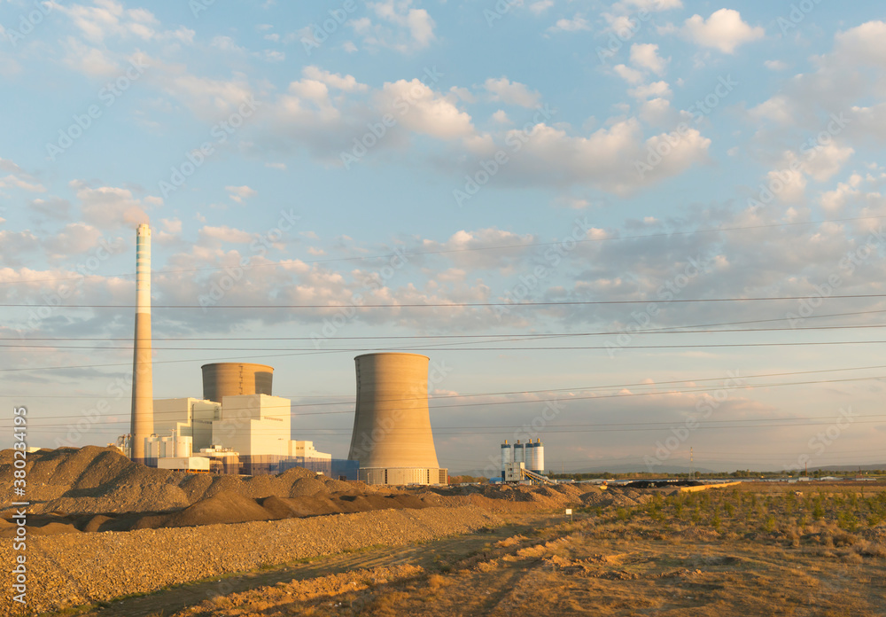 Chimney of power station on field under blue sky Chimney of power station on field under blue sky