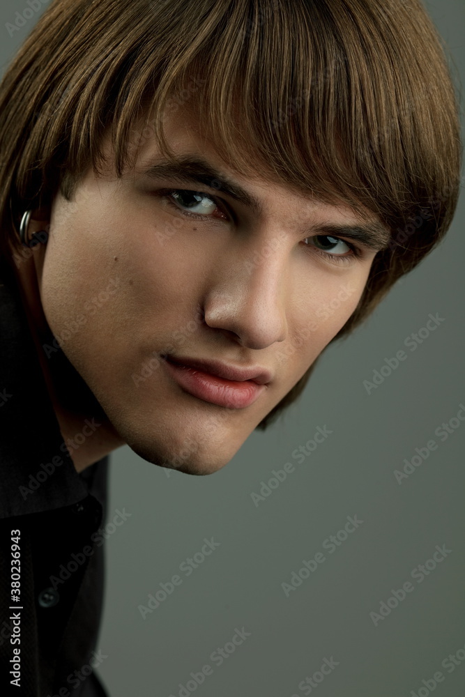 Studio portrait of handsome young man. Clean shaven man Studio portrait of handsome young man. Clean shaven man