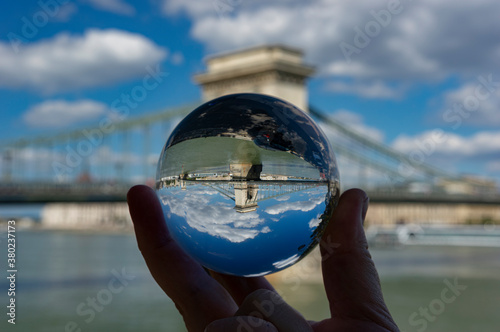 Hungarian Parliament through a crystal ball creating an abstract reflection