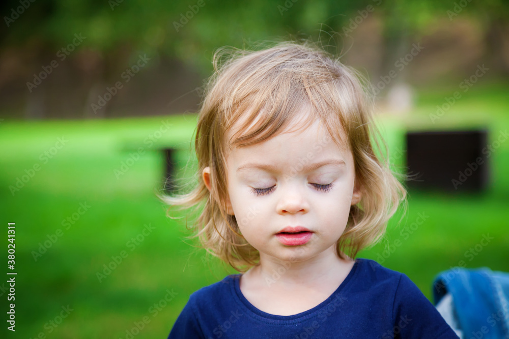 portrait of a cute little girl with closed eyes portrait of a cute little girl with closed eyes