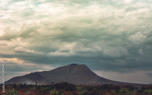 mountain during sunset with dramatic sky