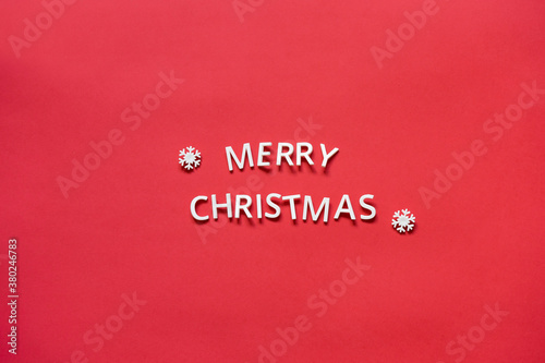 Inscription merry christmas from letters on a red background