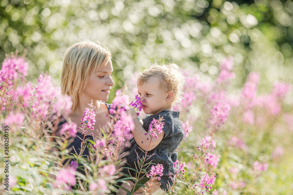 mother and daughter in flower field mother and daughter in flower field