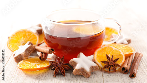 winter warm tea with dried oranges, spices and gingerbread cookies