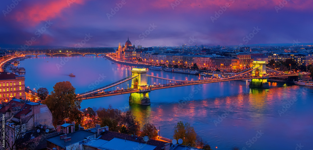 Beautiful evening image of Budapest,  incredible view on Budapest cityscape, with streetlight and colorful sky during sunset. wonderful picturesque Scene. Popular Travel destinations. perfect postcard
