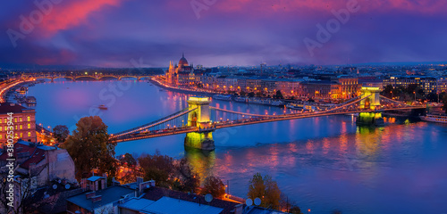 Photography Beautiful evening image of Budapest,  incredible view on Budapest cityscape, with streetlight and colorful sky during sunset