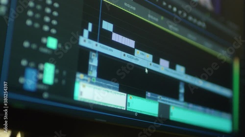 Wallpaper Mural Video editing on a computer. Monitor the computer and capture the work of the program for video editing: the fragments are connected together. Video processing, postproduction, clip maker Torontodigital.ca