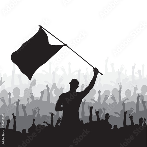 Man waving flag and crowd cheering