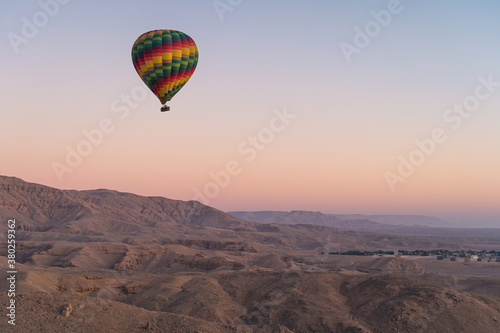 Hot air Balloon over Valley of the King in Luxor city in a beautiful morning sunrise, Upper Egypt
