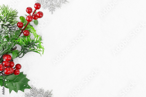 Christmas background. Branch of a Christmas tree and snowflakes in the snow. Christmas and New Year concept. Banner. Copy space