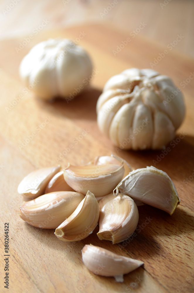 garlic on wooden table garlic on wooden table