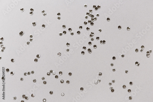 Wallpaper Mural Silver sequins on pastel background. Christmas or birthday backdrop. Torontodigital.ca