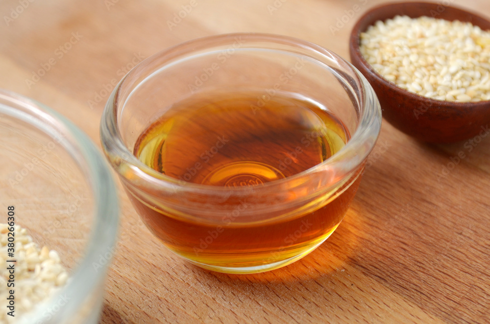 Cooking ingredient, Sesame oil in a glass bowl Cooking ingredient, Sesame oil in a glass bowl