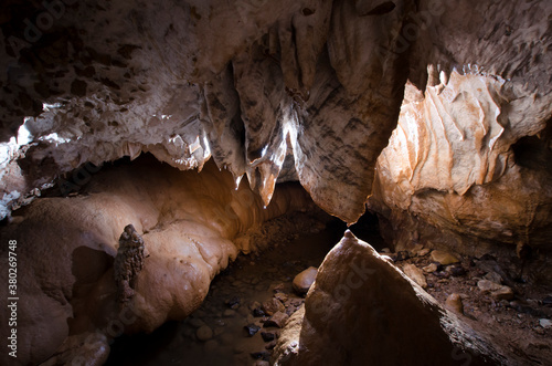 Cave with stalactite and stalagmite and limestone formations underground photo