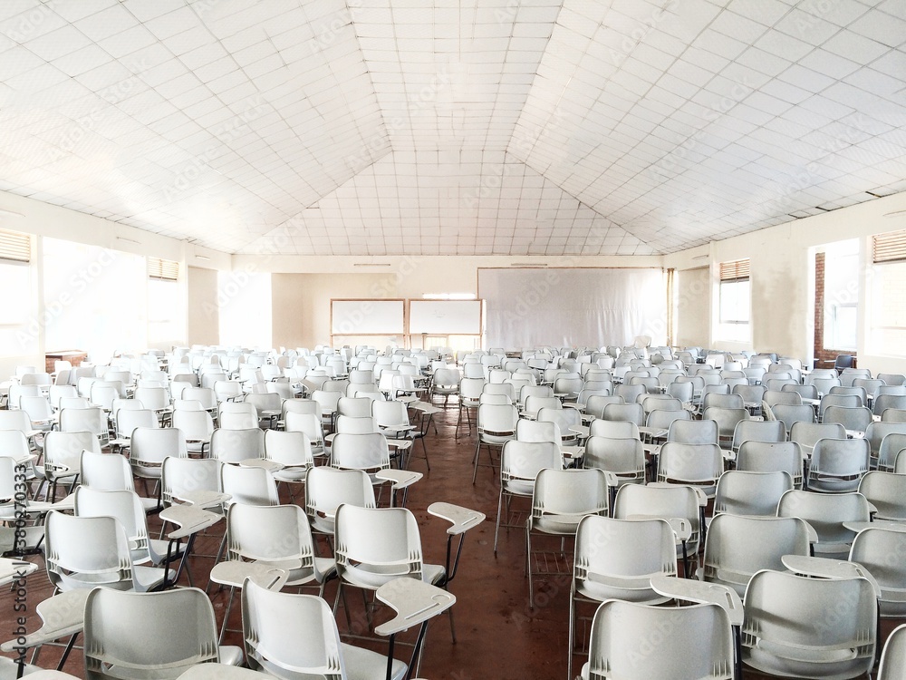 Hundreds of White Chairs in a White Classroom Hundreds of White Chairs in a White Classroom