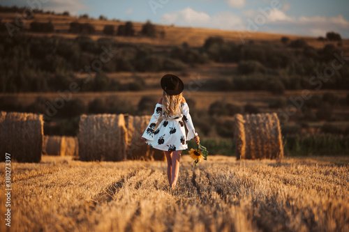 Happy young woman in white ...