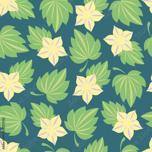 Seamless pattern of yellow flowers in the form of stars with leaves on a dark green background. © Yelana