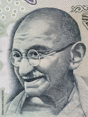 Foto Mahatma Gandhi portrait on indian 100 rupee banknote macro, India money closeup