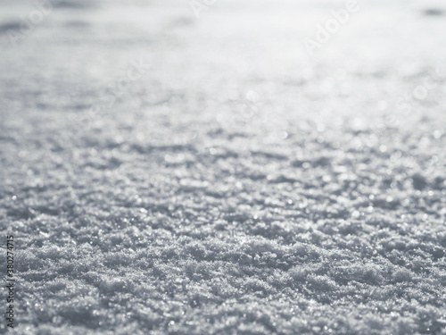 Snow surface close up macro, winter background, shallow depth of field