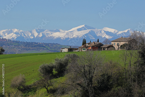 The sibillini mountains part of the range of the Apennines seen from the countryside in Le Marche in Italy in spring monti sibillini or sibelline photo