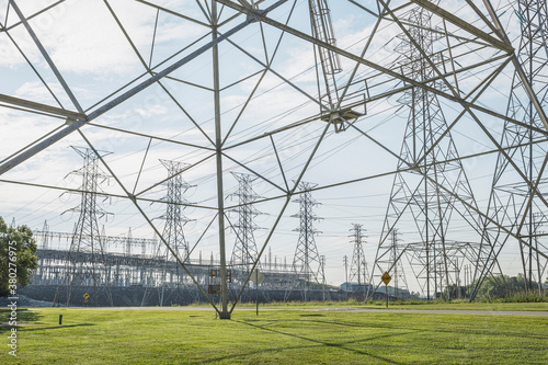 Electric power transmission towers and substation photo