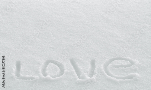 Word love drawing on snow surface, valentine's day greeting card wallpaper