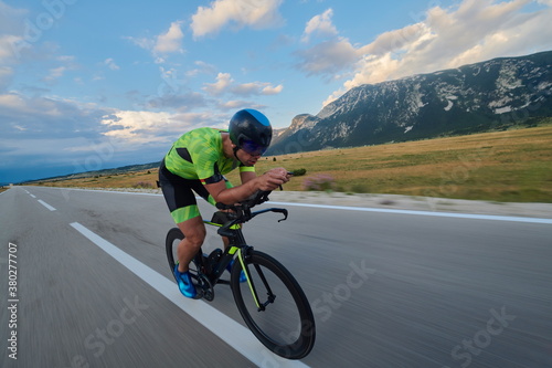 Fototapeta Naklejka Na Ścianę i Meble -  triathlon athlete riding bike