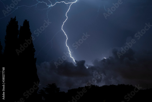  Lightning storm at night over the city. Concept on the subject of weather, cataclysms (hurricane, typhoon, tornado, storm)