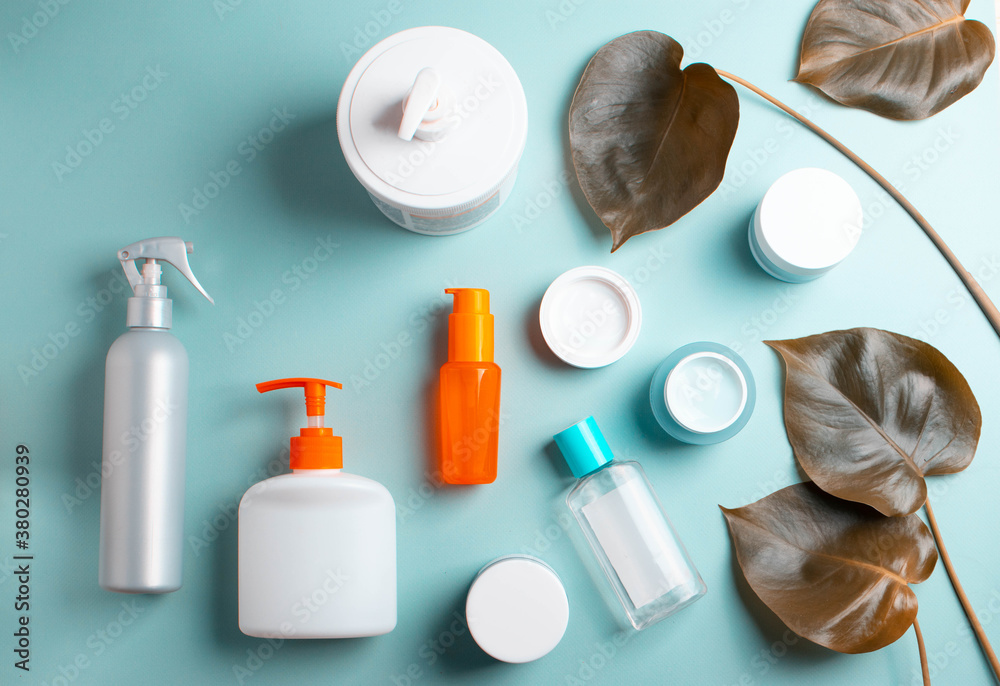 green leaves and face body care products. minimalism style green leaves and face body care products. minimalism style